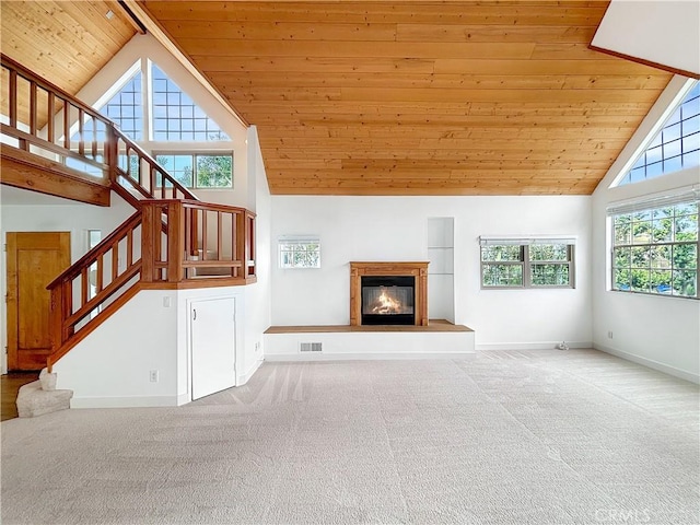 801 Nantasket Ct Unit B, San Diego, CA 92109 - unfurnished living room with wood ceiling, high vaulted ceiling, carpet, stairway, and a glass covered fireplace