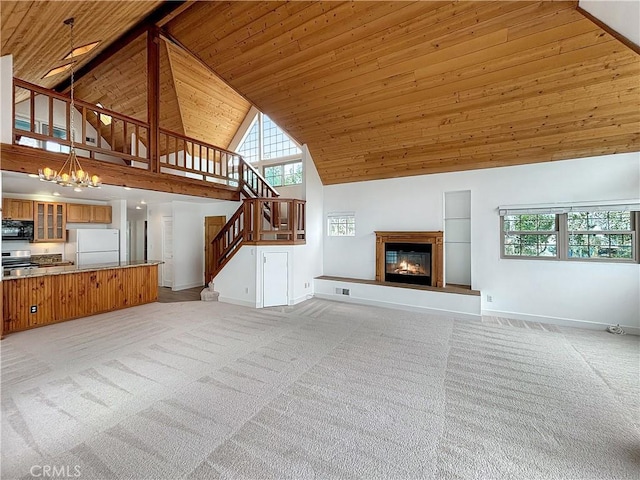 801 Nantasket Ct Unit B, San Diego, CA 92109 - unfurnished living room with high vaulted ceiling, wooden ceiling, light carpet, plenty of natural light, and a chandelier