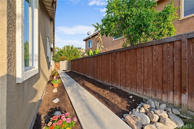 7476 Sequoia Ln, Highland, CA 92346 - view of side of home featuring stucco siding