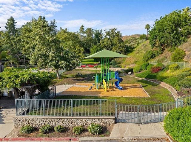 7476 Sequoia Ln, Highland, CA 92346 - community jungle gym featuring a gate