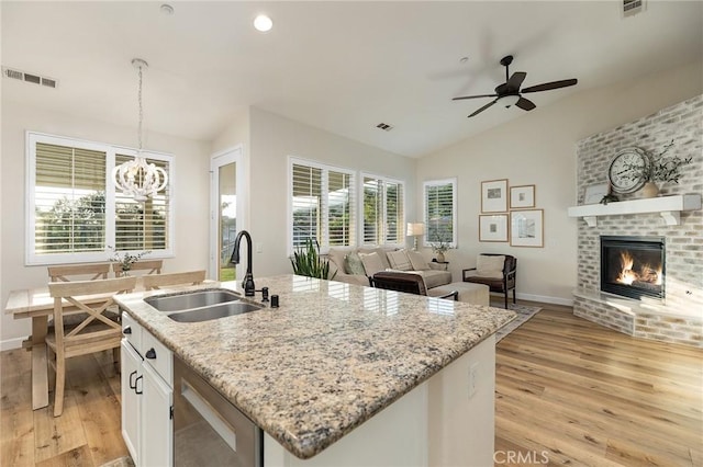 7476 Sequoia Ln, Highland, CA 92346 - kitchen featuring a sink, light wood-style flooring, open floor plan, a ceiling fan, and lofted ceiling
