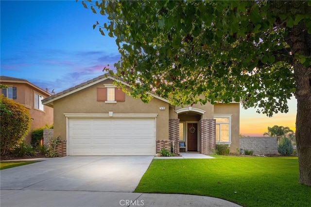 7476 Sequoia Ln, Highland, CA 92346 - view of front of property with stucco siding, concrete driveway, a front lawn, and an attached garage