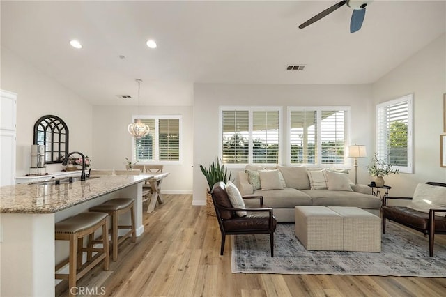 7476 Sequoia Ln, Highland, CA 92346 - living area with a ceiling fan, light wood-style flooring, a chandelier, recessed lighting, and baseboards