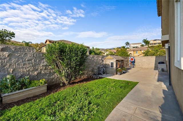 7476 Sequoia Ln, Highland, CA 92346 - fenced backyard with an outbuilding and a patio