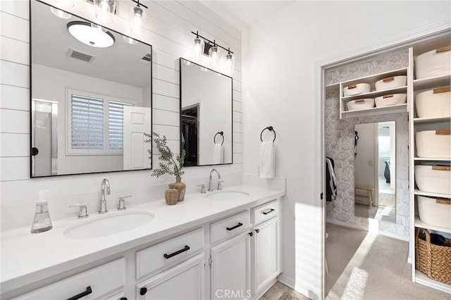 7476 Sequoia Ln, Highland, CA 92346 - bathroom with double vanity and a walk in closet