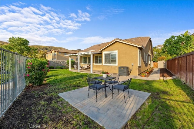 7476 Sequoia Ln, Highland, CA 92346 - back of property with stucco siding, central AC unit, a patio, and a tiled roof