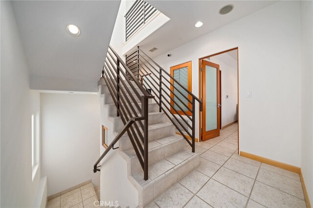 210 El Porto St, Manhattan Beach, CA 90266 - staircase featuring baseboards, tile patterned flooring, and recessed lighting
