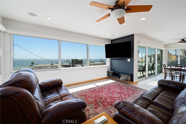 210 El Porto St, Manhattan Beach, CA 90266 - tiled living room featuring ceiling fan, healthy amount of natural light, recessed lighting, a water view, and baseboards