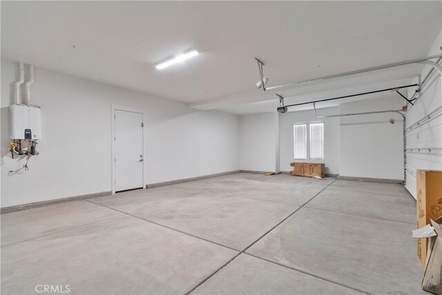 1734 Lester Ave, Clovis, CA 93619 - garage with tankless water heater and baseboards