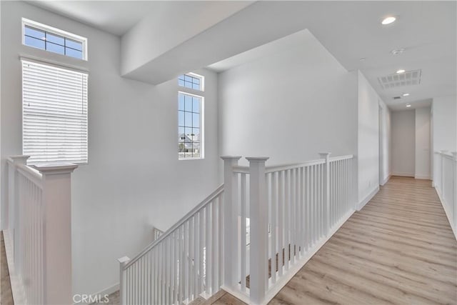 1734 Lester Ave, Clovis, CA 93619 - hall featuring an upstairs landing, wood finished floors, and recessed lighting