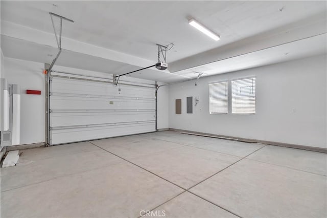 1734 Lester Ave, Clovis, CA 93619 - garage featuring a garage door opener, electric panel, and baseboards