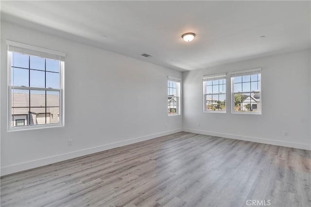 1734 Lester Ave, Clovis, CA 93619 - unfurnished room featuring light wood-type flooring and baseboards