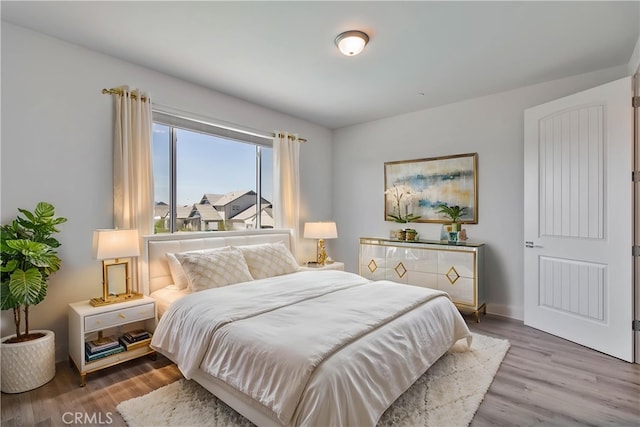 1734 Lester Ave, Clovis, CA 93619 - bedroom featuring wood finished floors and baseboards