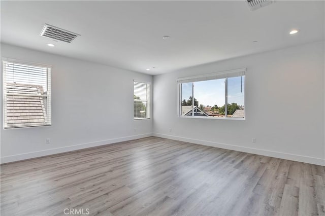 1734 Lester Ave, Clovis, CA 93619 - empty room with light wood-style floors, recessed lighting, and baseboards