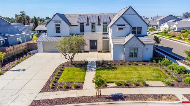 1734 Lester Ave, Clovis, CA 93619 - view of front of home with a residential view, driveway, a garage, stucco siding, and metal roof