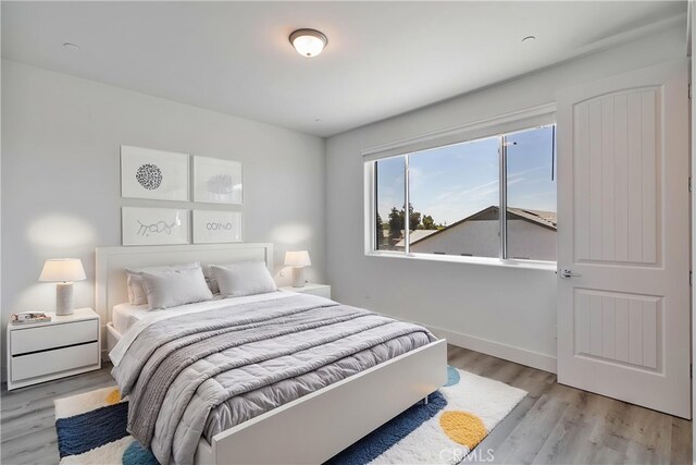 1734 Lester Ave, Clovis, CA 93619 - bedroom with light wood-type flooring and baseboards
