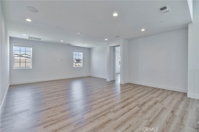 1734 Lester Ave, Clovis, CA 93619 - empty room with recessed lighting, light wood-style floors, and baseboards