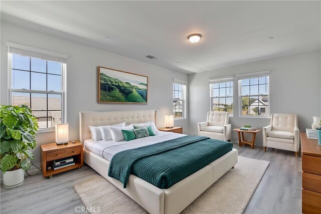 1734 Lester Ave, Clovis, CA 93619 - bedroom featuring multiple windows and light wood-type flooring