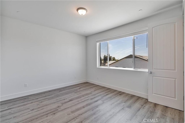 1734 Lester Ave, Clovis, CA 93619 - empty room with wood finished floors and baseboards