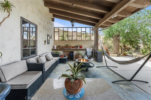 9075 Mesa Vista St, Apple Valley, CA 92308 - view of patio / terrace with an outdoor living space with a fire pit