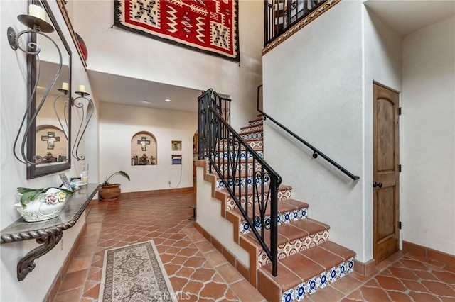 9075 Mesa Vista St, Apple Valley, CA 92308 - stairway featuring baseboards, recessed lighting, tile patterned flooring, and a high ceiling