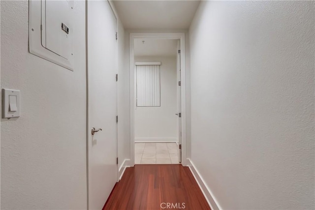 395 E 4th St Unit 13, Long Beach, CA 90802 - corridor with electric panel, dark wood-type flooring, and baseboards