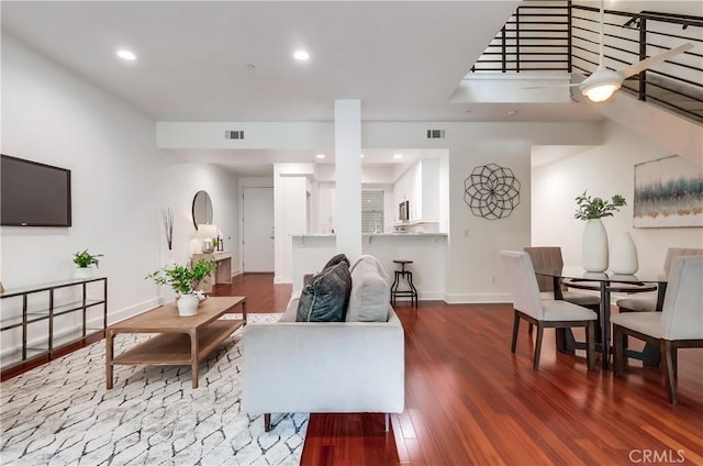 395 E 4th St Unit 13, Long Beach, CA 90802 - living room featuring wood finished floors, baseboards, and recessed lighting