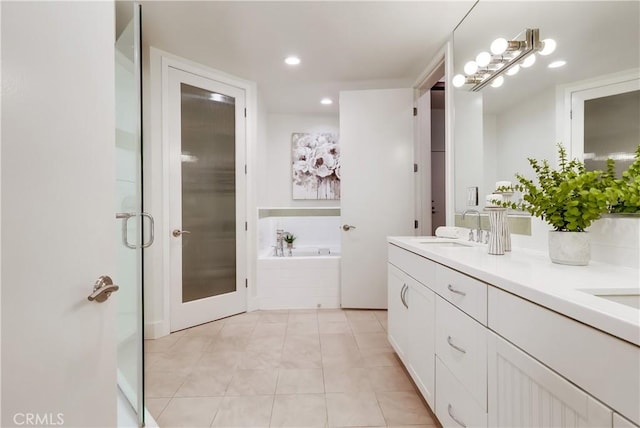 395 E 4th St Unit 13, Long Beach, CA 90802 - bathroom with double vanity, a garden tub, tile patterned floors, and recessed lighting