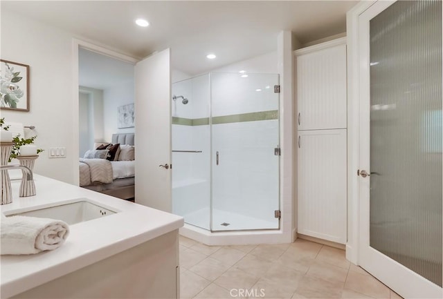 395 E 4th St Unit 13, Long Beach, CA 90802 - ensuite bathroom with vanity, a stall shower, tile patterned floors, and recessed lighting