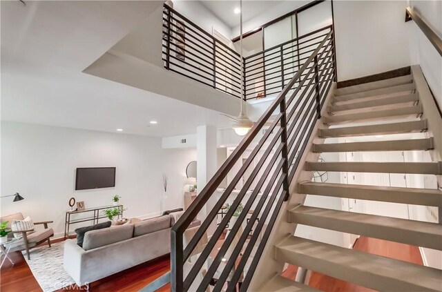 395 E 4th St Unit 13, Long Beach, CA 90802 - staircase featuring wood finished floors, baseboards, and recessed lighting
