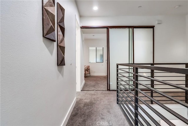 395 E 4th St Unit 13, Long Beach, CA 90802 - hallway featuring an upstairs landing, carpet flooring, and baseboards