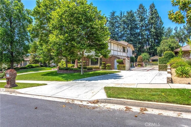 639 Valley View Dr, Redlands, CA 92373 - view of front facade with a front lawn, driveway, and brick siding