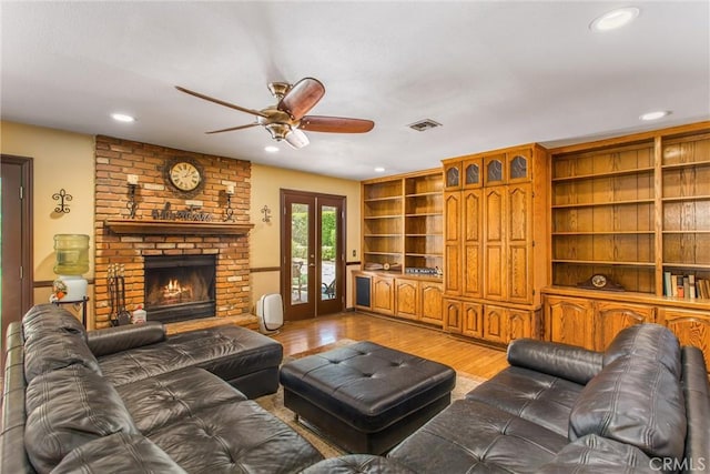 639 Valley View Dr, Redlands, CA 92373 - living area featuring light wood-style flooring, ceiling fan, recessed lighting, a brick fireplace, and french doors