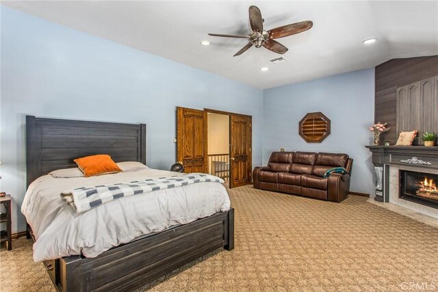 639 Valley View Dr, Redlands, CA 92373 - carpeted bedroom featuring lofted ceiling, recessed lighting, a fireplace with flush hearth, and ceiling fan