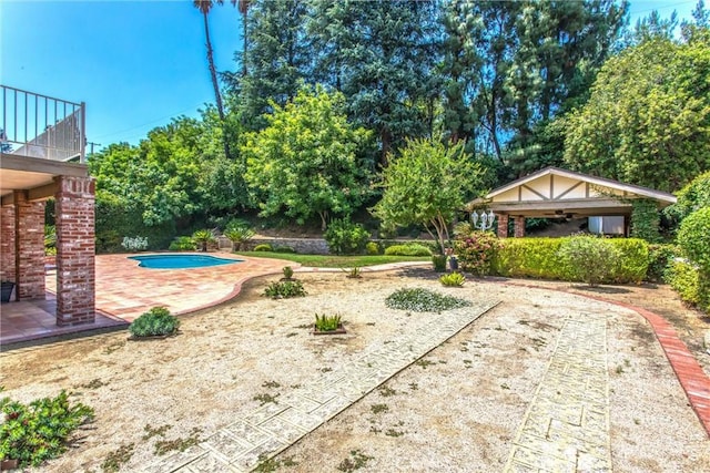639 Valley View Dr, Redlands, CA 92373 - view of yard featuring a ceiling fan, a patio area, an outdoor pool, and a balcony