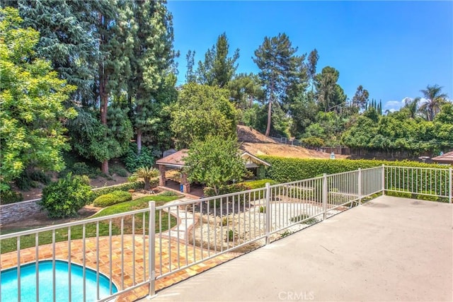 639 Valley View Dr, Redlands, CA 92373 - view of swimming pool featuring a patio area and view of scattered trees