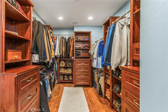 639 Valley View Dr, Redlands, CA 92373 - walk in closet with dark wood finished floors