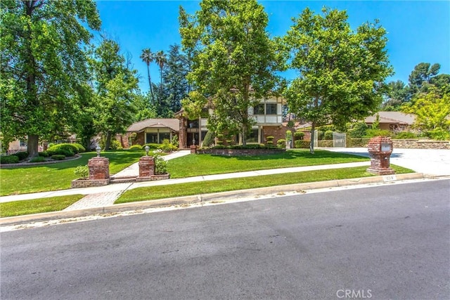 639 Valley View Dr, Redlands, CA 92373 - view of property hidden behind natural elements with a front lawn and driveway