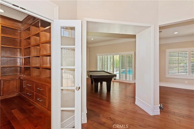 7000 Fabriano Pl, Rancho Cucamonga, CA 91701 - hallway featuring ornamental molding, dark wood-style floors, healthy amount of natural light, baseboards, and recessed lighting