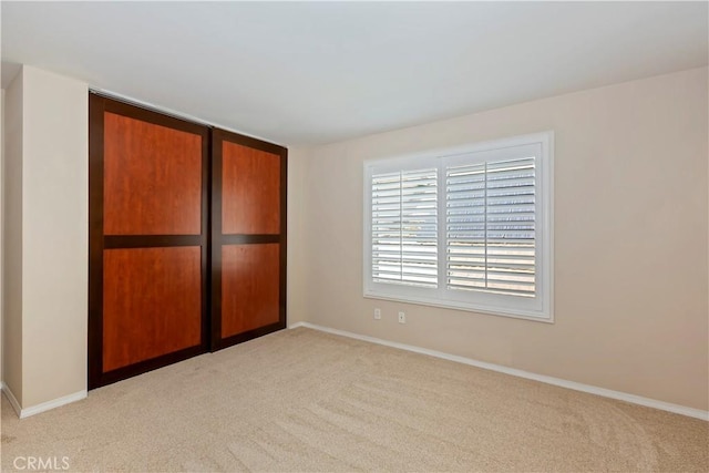 7000 Fabriano Pl, Rancho Cucamonga, CA 91701 - unfurnished bedroom with light colored carpet, baseboards, and a closet