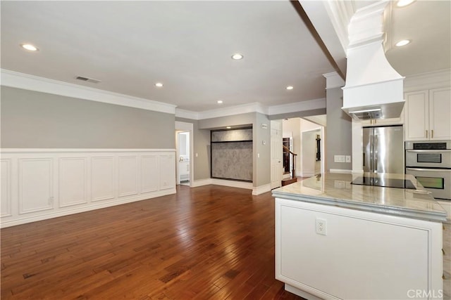 7000 Fabriano Pl, Rancho Cucamonga, CA 91701 - kitchen with appliances with stainless steel finishes, open floor plan, ornamental molding, a kitchen island, and dark wood-type flooring