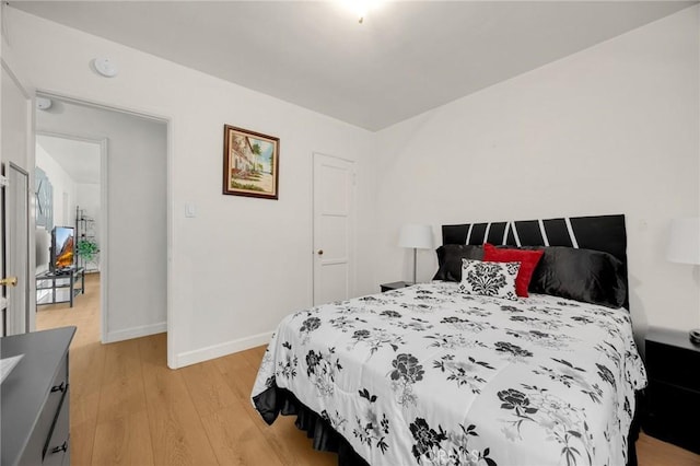11705 Adonis Ave, Norwalk, CA 90650 - bedroom with light wood-style flooring and baseboards