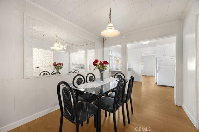 11705 Adonis Ave, Norwalk, CA 90650 - dining area featuring ornamental molding and wood finished floors