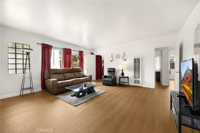 11705 Adonis Ave, Norwalk, CA 90650 - living area featuring a heating unit and light wood-style flooring