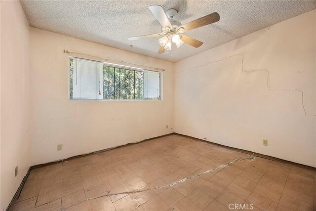 5426 Lakeview Ave, Yorba Linda, CA 92886 - spare room featuring tile patterned floors, a ceiling fan, and a textured ceiling