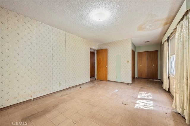 5426 Lakeview Ave, Yorba Linda, CA 92886 - unfurnished room featuring wallpapered walls, a textured ceiling, and baseboards