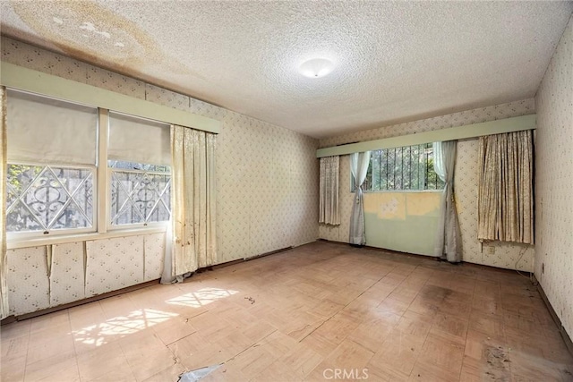 5426 Lakeview Ave, Yorba Linda, CA 92886 - spare room with wallpapered walls and a textured ceiling
