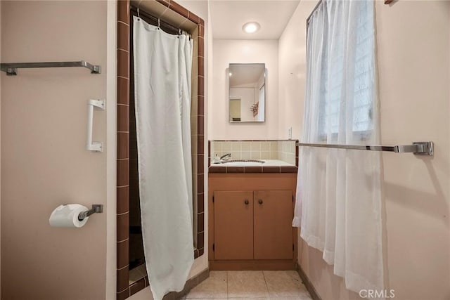 5426 Lakeview Ave, Yorba Linda, CA 92886 - full bathroom with vanity, a shower with shower curtain, tile patterned floors, and backsplash
