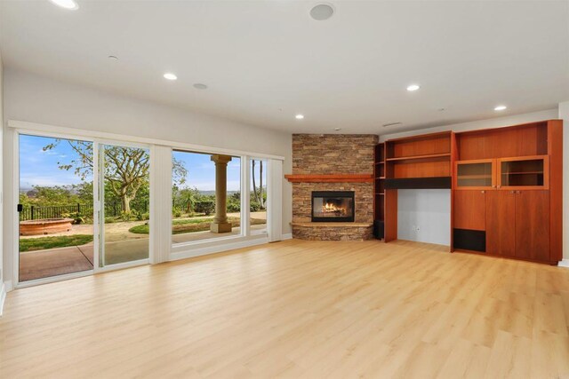 1320 Sleeping Indian Rd, Oceanside, CA 92057 - unfurnished living room with recessed lighting, light wood-style floors, and a fireplace