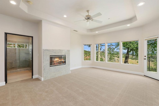 1320 Sleeping Indian Rd, Oceanside, CA 92057 - unfurnished living room with light carpet, a raised ceiling, recessed lighting, and healthy amount of natural light